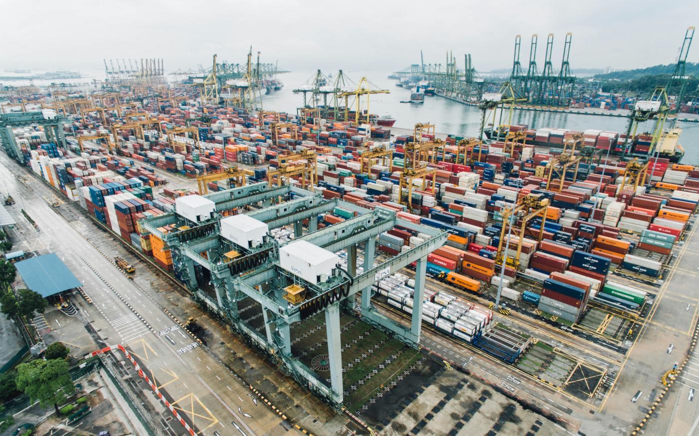 intermodal containers on dock by CHUTTERSNAP courtesy of Unsplash.